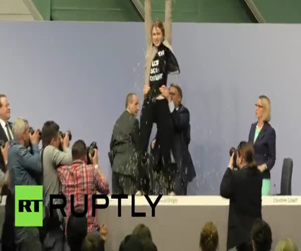 Активистка FEMEN на пресс-конференции главы ЕЦБ