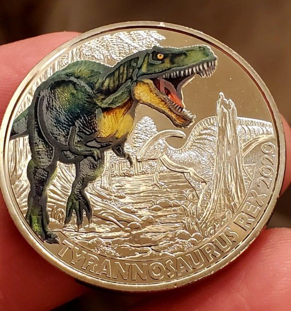 Три евро с изображением динозавра